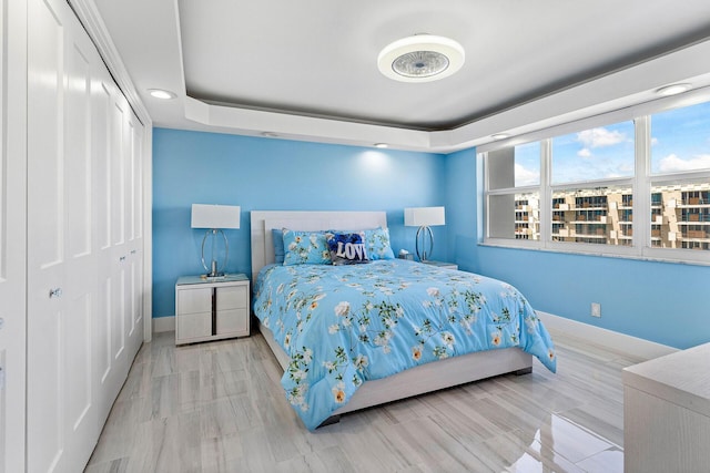 3000 S Ocean Blvd Unit 6010, Boca Raton, FL 33432 - bedroom with baseboards, a closet, and a tray ceiling