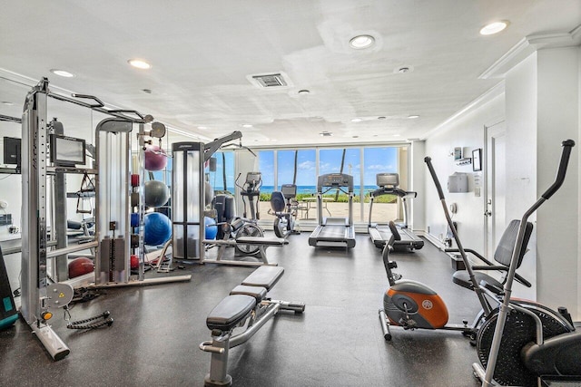 3000 S Ocean Blvd Unit 6010, Boca Raton, FL 33432 - exercise room with a wall of windows, crown molding, and recessed lighting