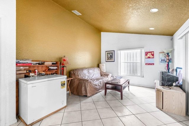 9023 Seminole Pratt Whitney Rd, The Acreage, FL 33470 - living area featuring lofted ceiling, a textured ceiling, light tile patterned flooring, and recessed lighting