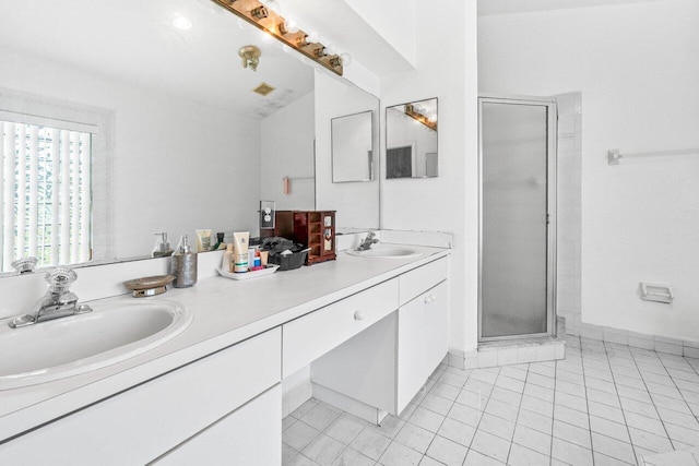 9023 Seminole Pratt Whitney Rd, The Acreage, FL 33470 - full bath with a stall shower, double vanity, tile patterned flooring, and baseboards