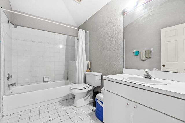 9023 Seminole Pratt Whitney Rd, The Acreage, FL 33470 - bathroom featuring a textured wall, tile patterned floors, shower / bath combination with curtain, toilet, and vanity