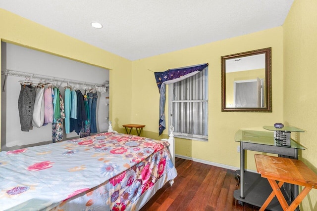 9023 Seminole Pratt Whitney Rd, The Acreage, FL 33470 - bedroom featuring wood finished floors, a closet, and baseboards