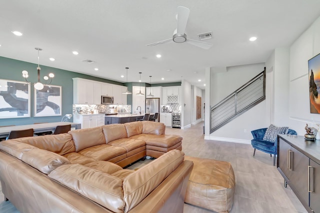 4646 Eventing St, Lake Worth, FL 33467 - living area with ceiling fan, recessed lighting, stairs, and wine cooler
