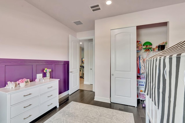 4646 Eventing St, Lake Worth, FL 33467 - bedroom with wainscoting, dark wood finished floors, a closet, recessed lighting, and a decorative wall