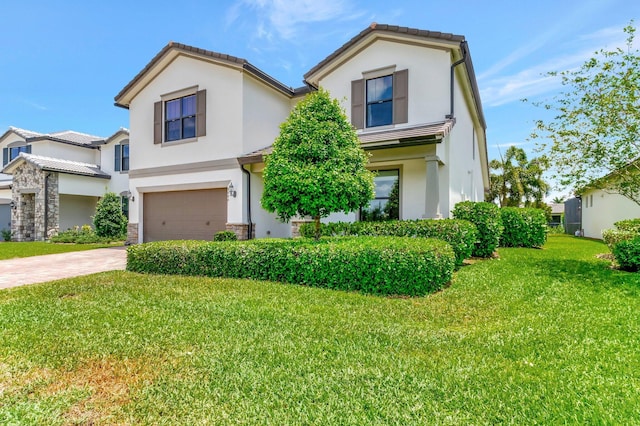 4646 Eventing St, Lake Worth, FL 33467 - view of front of home with an attached garage, driveway, a front yard, stucco siding, and a tile roof