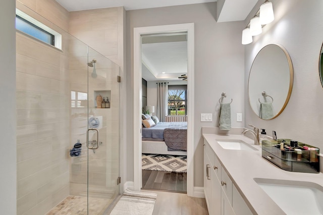 4646 Eventing St, Lake Worth, FL 33467 - ensuite bathroom featuring a shower stall, double vanity, and wood finished floors