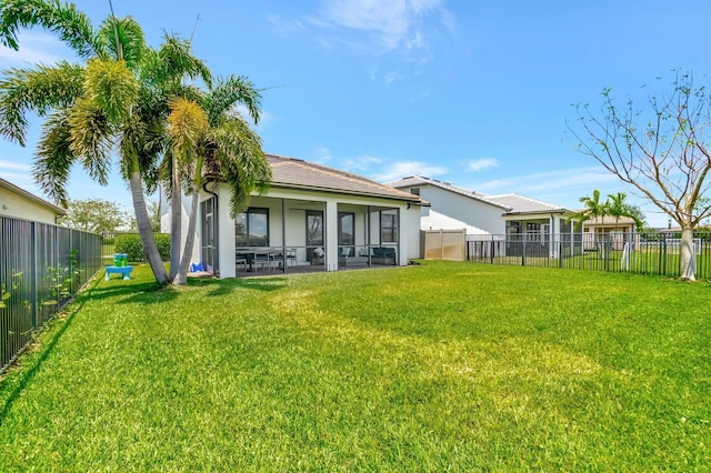 4646 Eventing St, Lake Worth, FL 33467 - back of house featuring a sunroom, a fenced backyard, and stucco siding