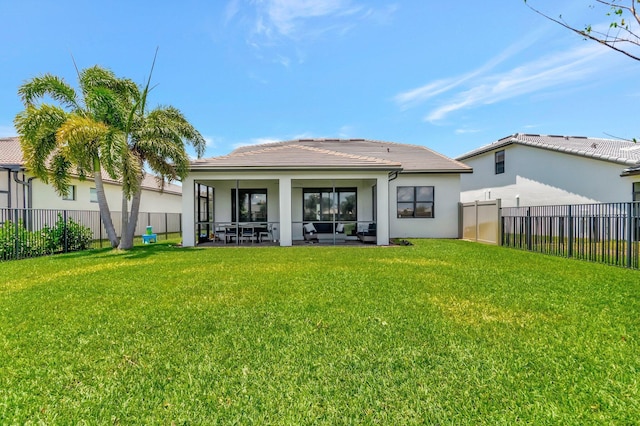 4646 Eventing St, Lake Worth, FL 33467 - back of property featuring a fenced backyard, stucco siding, a tiled roof, and a sunroom