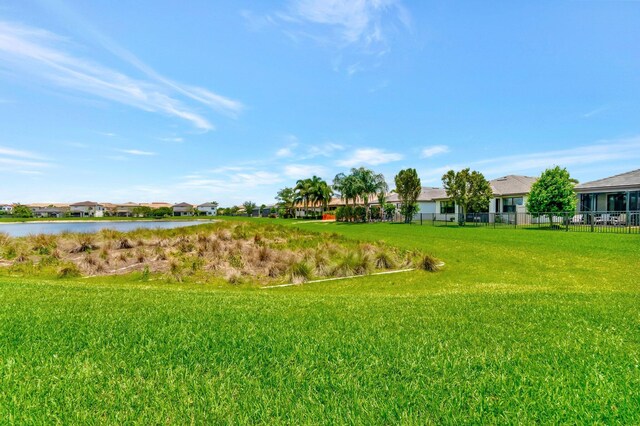 4646 Eventing St, Lake Worth, FL 33467 - view of yard with a water view and a residential view