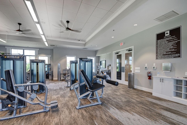 4646 Eventing St, Lake Worth, FL 33467 - workout area featuring ceiling fan, wood finished floors, a tray ceiling, and french doors