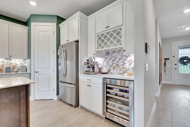4646 Eventing St, Lake Worth, FL 33467 - kitchen with stainless steel fridge with ice dispenser, beverage cooler, light countertops, tasteful backsplash, and recessed lighting