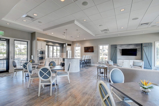 4646 Eventing St, Lake Worth, FL 33467 - dining area featuring plenty of natural light, wood finished floors, and ornamental molding