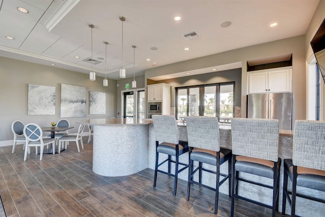 4646 Eventing St, Lake Worth, FL 33467 - kitchen featuring stainless steel appliances, white cabinetry, pendant lighting, recessed lighting, and dark wood-type flooring