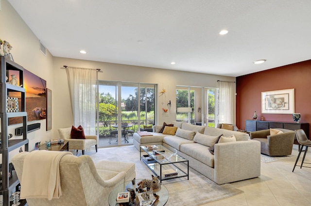 living room featuring french doors, recessed lighting, and light tile patterned flooring