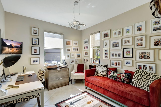 home office featuring healthy amount of natural light, light tile patterned floors, and a chandelier