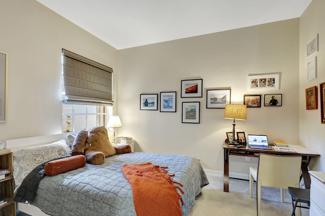 bedroom featuring carpet floors, a desk, and baseboards