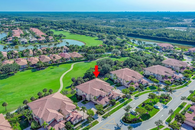 aerial view of residential area with a nearby body of water and a golf club