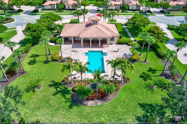 aerial perspective of suburban area featuring a pool area
