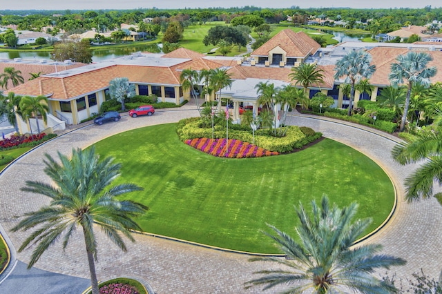 aerial perspective of suburban area with a nearby body of water