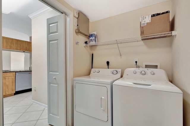 6510 Emerald Dunes Dr Unit 302, West Palm Beach, FL 33411 - clothes washing area with washer and dryer and light tile patterned flooring
