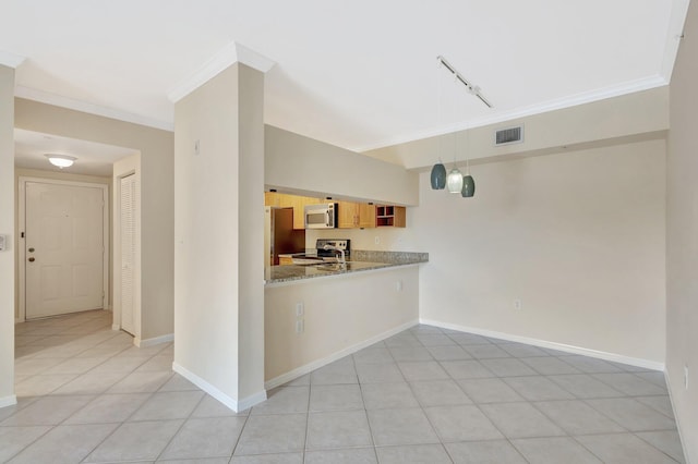 6510 Emerald Dunes Dr Unit 302, West Palm Beach, FL 33411 - kitchen with stainless steel appliances, crown molding, track lighting, baseboards, and decorative light fixtures