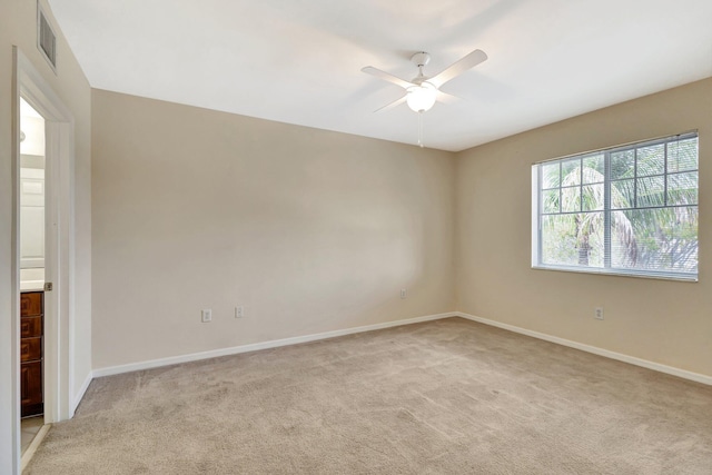 6510 Emerald Dunes Dr Unit 302, West Palm Beach, FL 33411 - spare room with a ceiling fan, light carpet, and baseboards