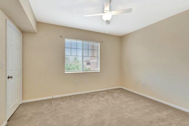 6510 Emerald Dunes Dr Unit 302, West Palm Beach, FL 33411 - unfurnished bedroom featuring light colored carpet, baseboards, and ceiling fan