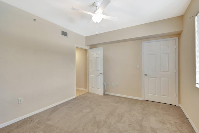 6510 Emerald Dunes Dr Unit 302, West Palm Beach, FL 33411 - unfurnished room featuring light carpet, a ceiling fan, and baseboards