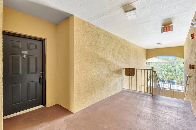 6510 Emerald Dunes Dr Unit 302, West Palm Beach, FL 33411 - entrance to property with stucco siding and a balcony