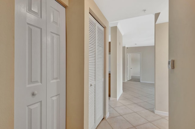 6510 Emerald Dunes Dr Unit 302, West Palm Beach, FL 33411 - hallway with light tile patterned floors and baseboards