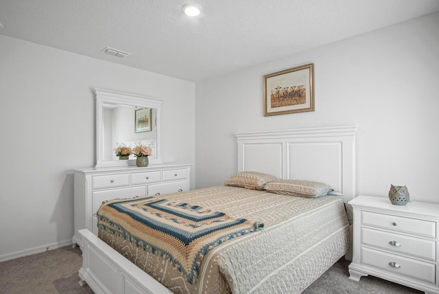 bedroom featuring carpet and baseboards