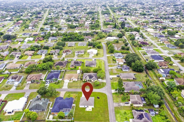 aerial view of property's location with nearby suburban area