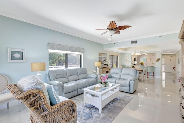 living area with crown molding, a chandelier, a ceiling fan, and light tile patterned flooring