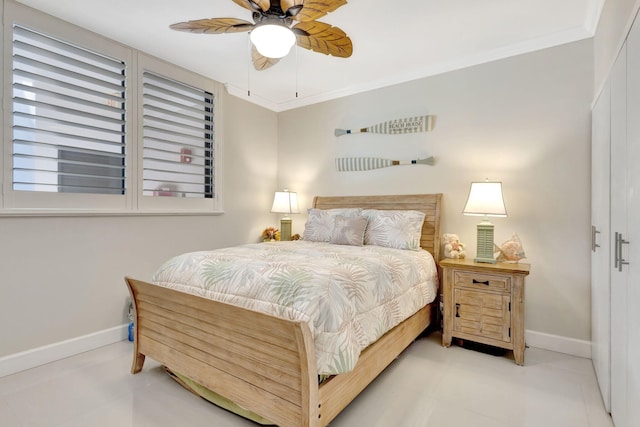 tiled bedroom featuring baseboards, ornamental molding, and ceiling fan