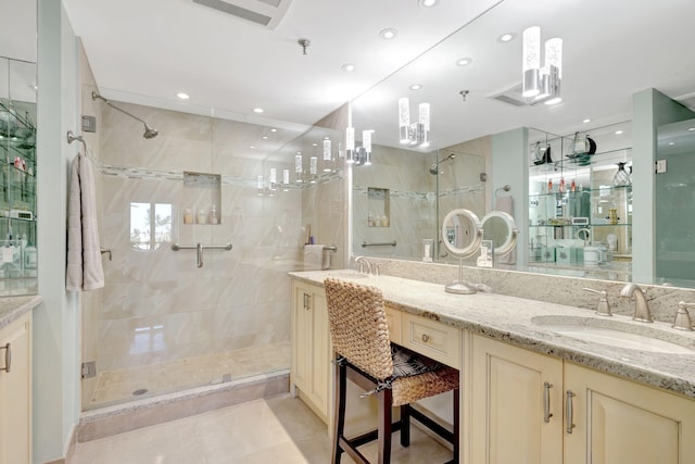 full bathroom featuring a stall shower, double vanity, tile patterned flooring, and recessed lighting