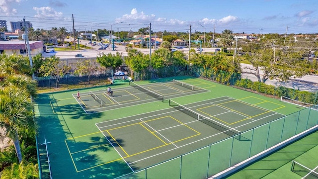 view of tennis court with fence