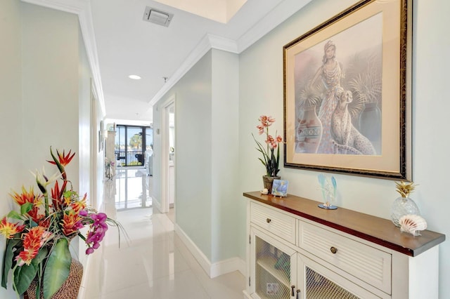 hallway featuring ornamental molding, baseboards, light tile patterned floors, and recessed lighting