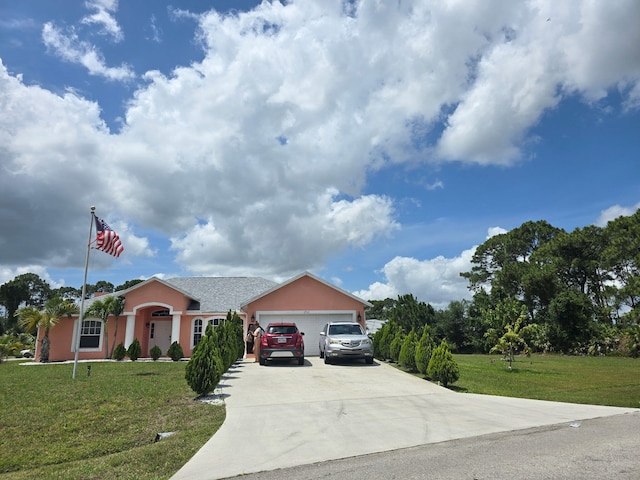 ranch-style home with a front lawn, concrete driveway, a garage, and stucco siding