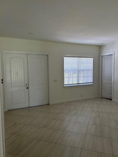 14413 71st Pl N, Loxahatchee, FL 33470 - foyer entrance featuring baseboards