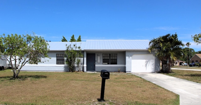 1561 SE Arenson Ln, Port Saint Lucie, FL 34952 - ranch-style house featuring a garage, a front lawn, concrete driveway, stucco siding, and metal roof