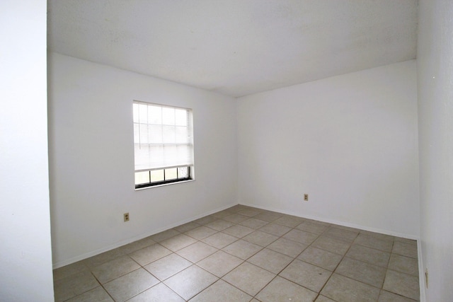 1561 SE Arenson Ln, Port Saint Lucie, FL 34952 - spare room with light tile patterned floors