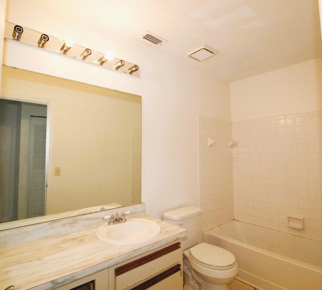 1561 SE Arenson Ln, Port Saint Lucie, FL 34952 - bathroom with vanity, toilet, and washtub / shower combination