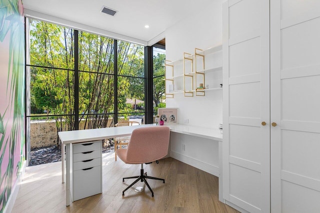 home office featuring light wood-style flooring