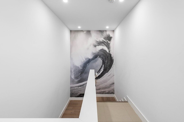 corridor featuring recessed lighting and baseboards