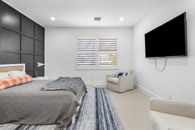 tiled bedroom with baseboards and recessed lighting