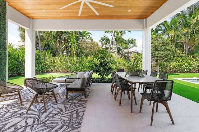 view of patio / terrace featuring ceiling fan and outdoor dining space