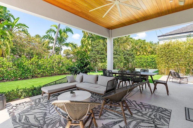 view of patio featuring a ceiling fan, outdoor dining area, and an outdoor living space