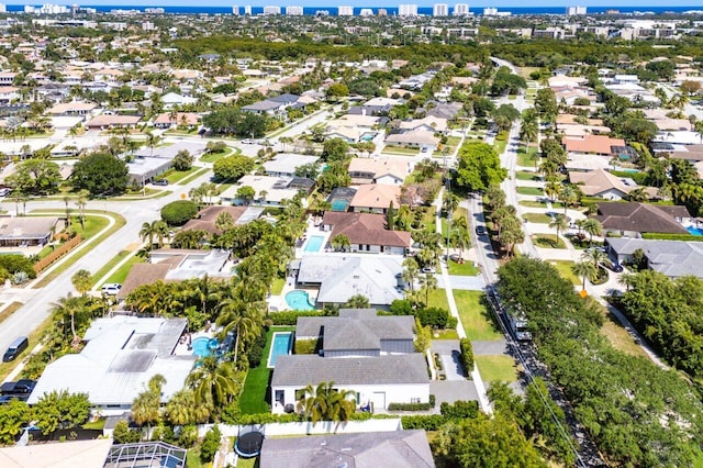 aerial view of property and surrounding area with nearby suburban area, a nearby body of water, and nearby urban area