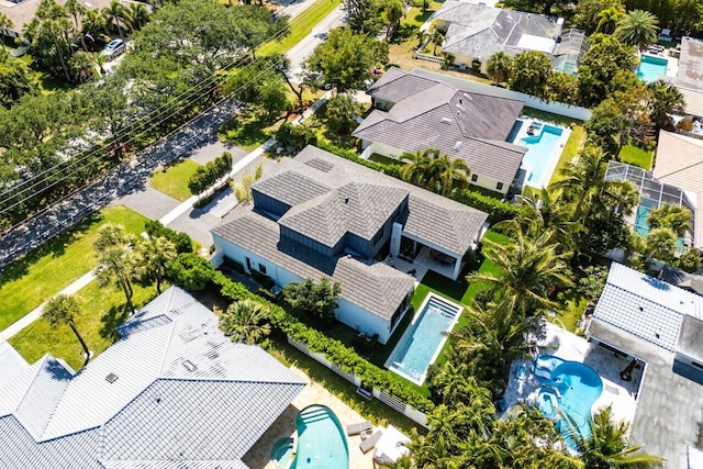 aerial perspective of suburban area featuring a pool area