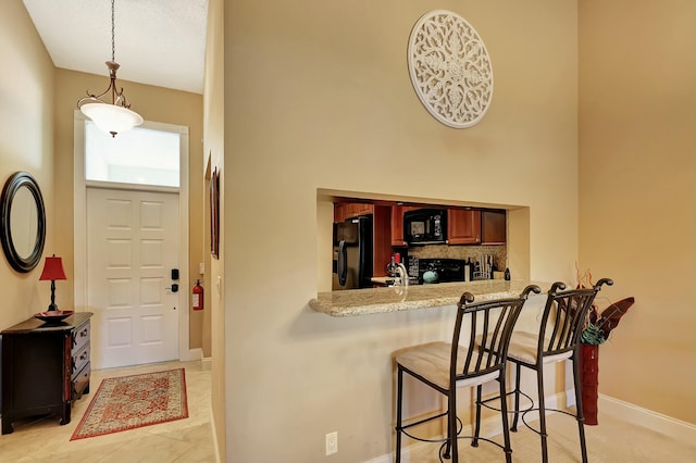 212 Cypress Point Dr, Palm Beach Gardens, FL 33418 - entrance foyer with baseboards and a high ceiling